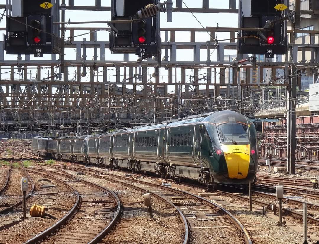 GWR Intercity Express Train passing colour light signals on the UK rail network — signal observation is a core train driver skill